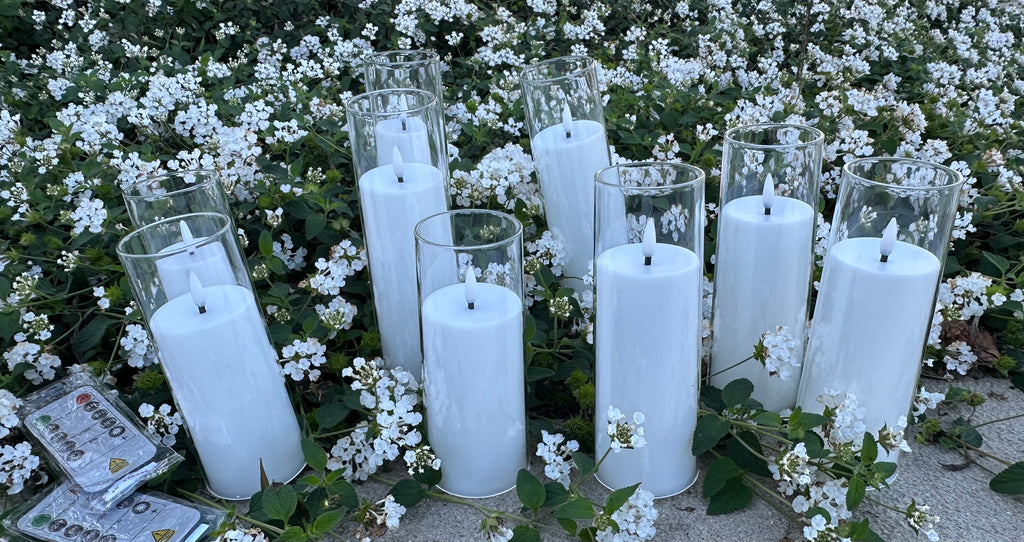 9 - White Flameless Battery-operated candles that last over 300 hours on just one single battery! Requires - AA battery (not included) Comes with 2 remote. Pack of 9 candles. $40