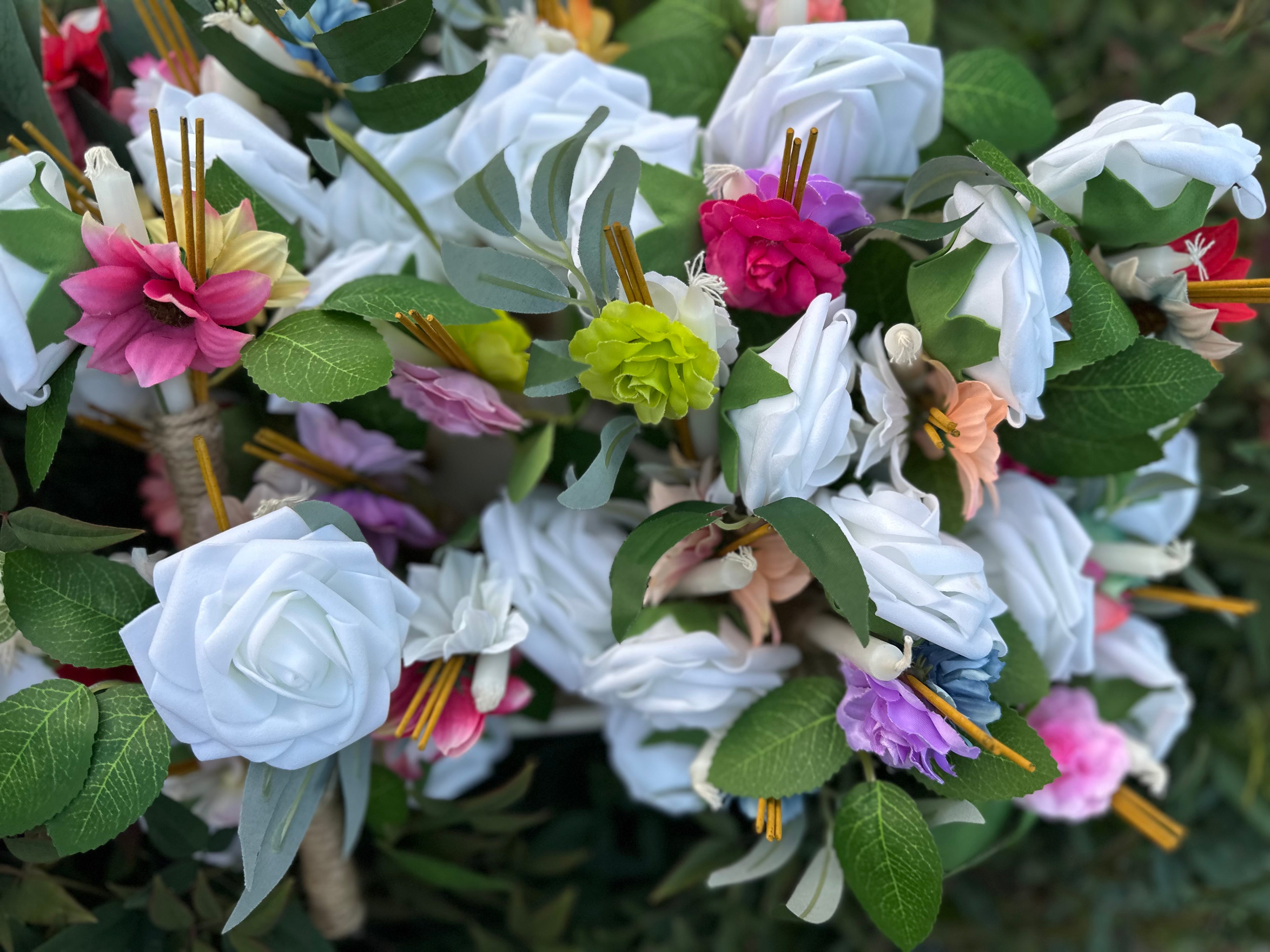 Traditional Cambodian funeral flower bundles with candle and incense. Set of 25 mixed-color offering sets, handmade to honor loved ones with Khmer traditions. $100 for set of 25
